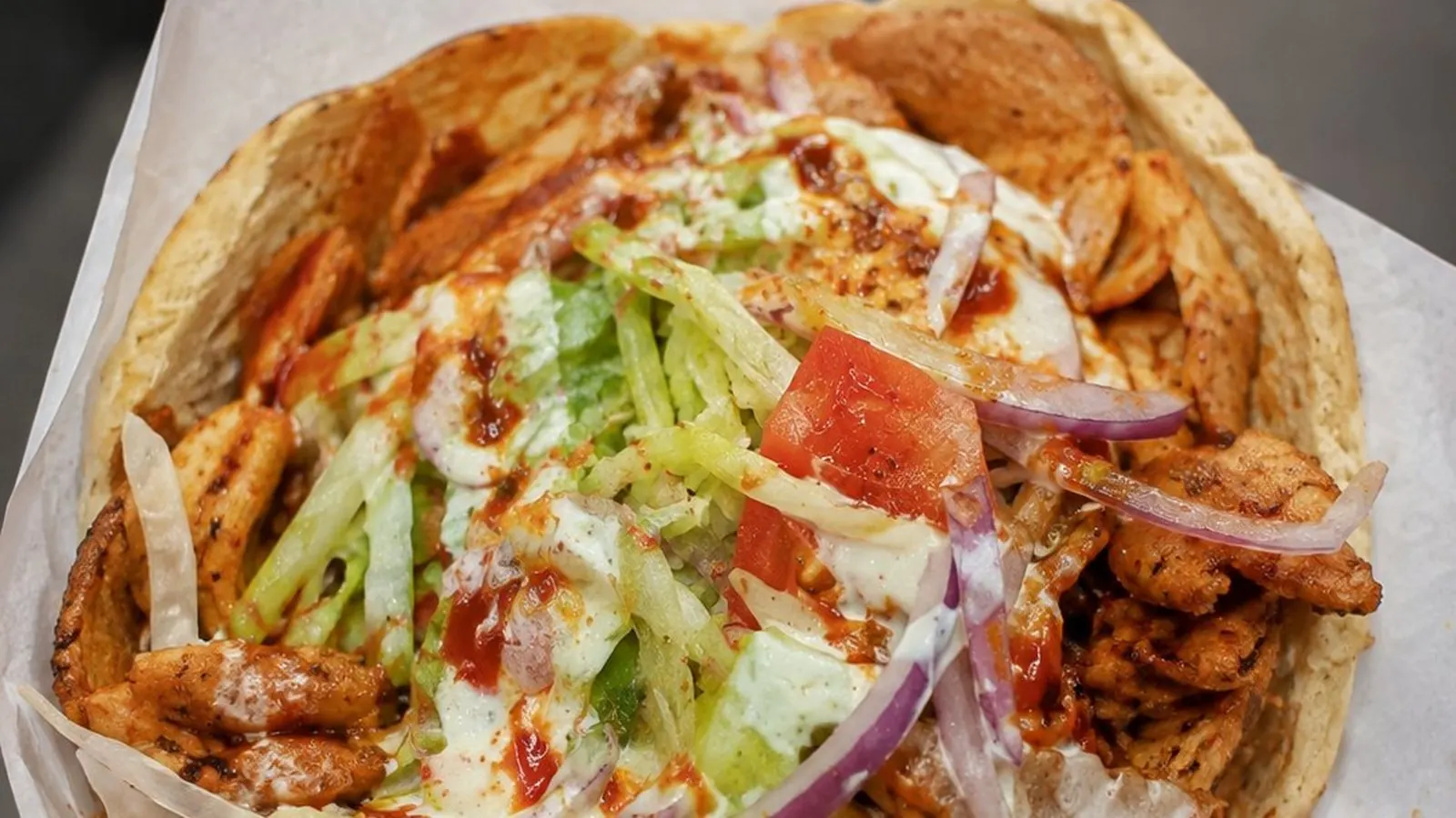 Kebab in pitta with salad and sauces