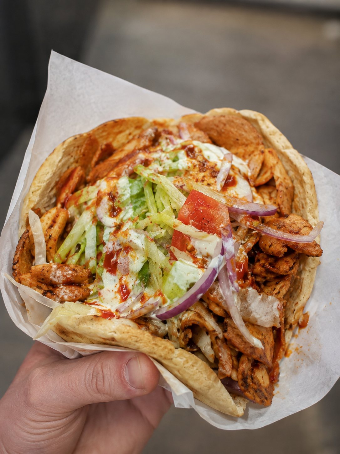 Kebab in pitta with salad and sauces