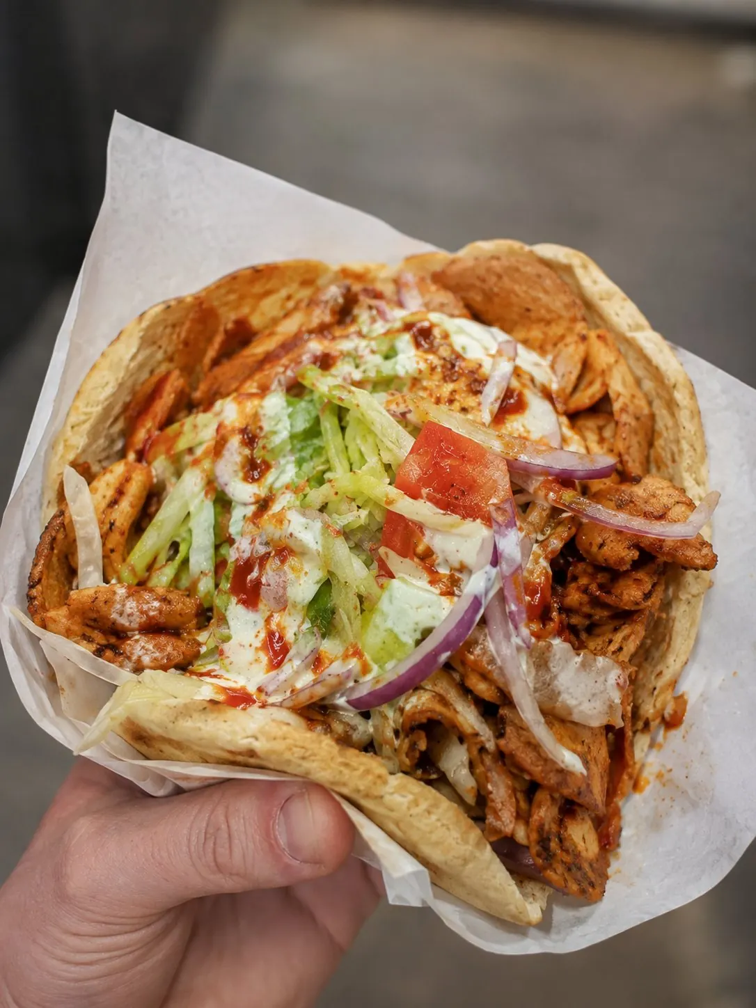 Kebab in pitta with salad and sauces